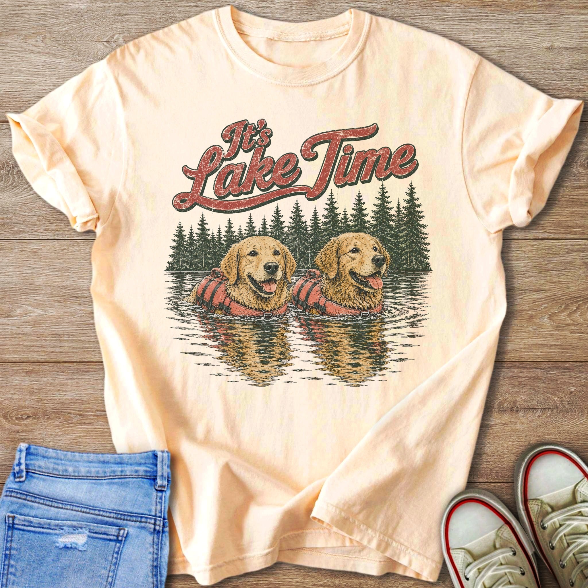 Golden retrievers wearing life jackets in water with text "It's Lake Time".