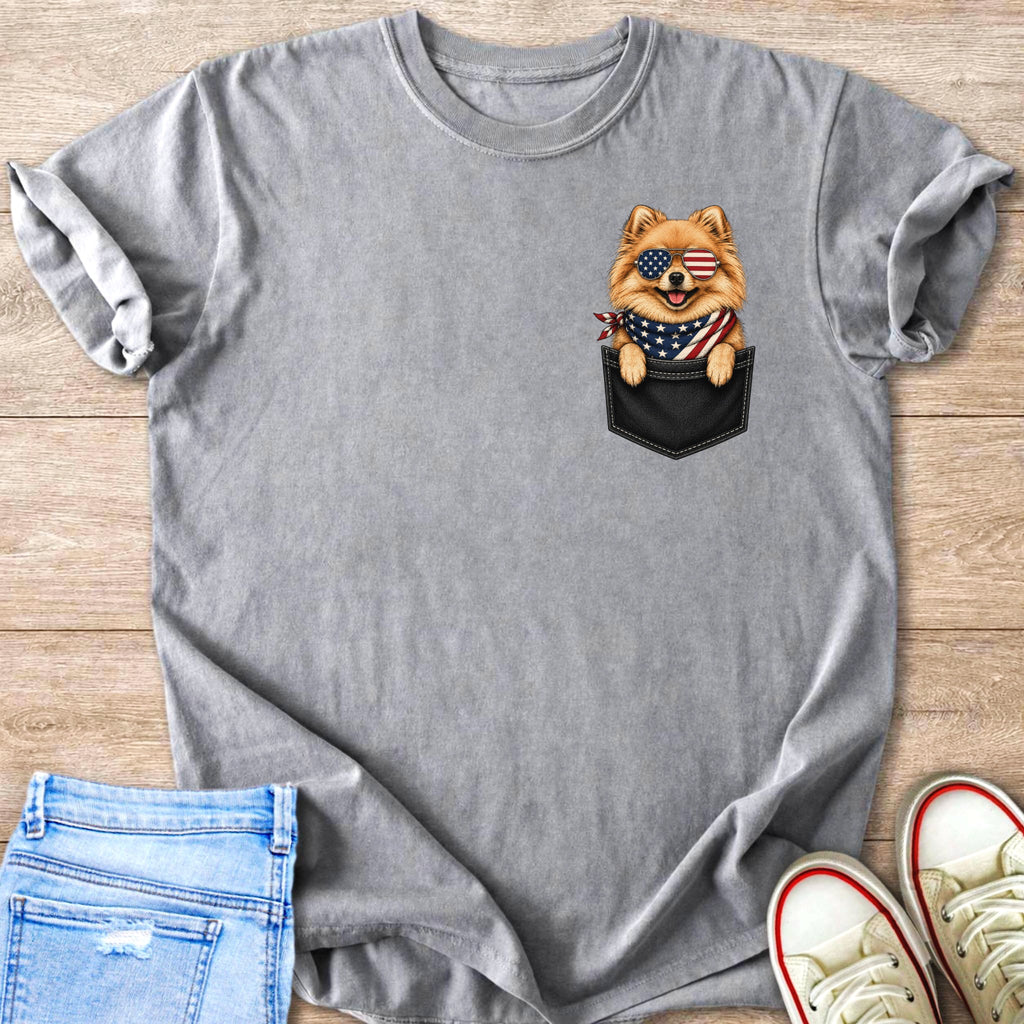 Pomeranian dog wearing American flag sunglasses and bandana in pocket print on grey t-shirt.