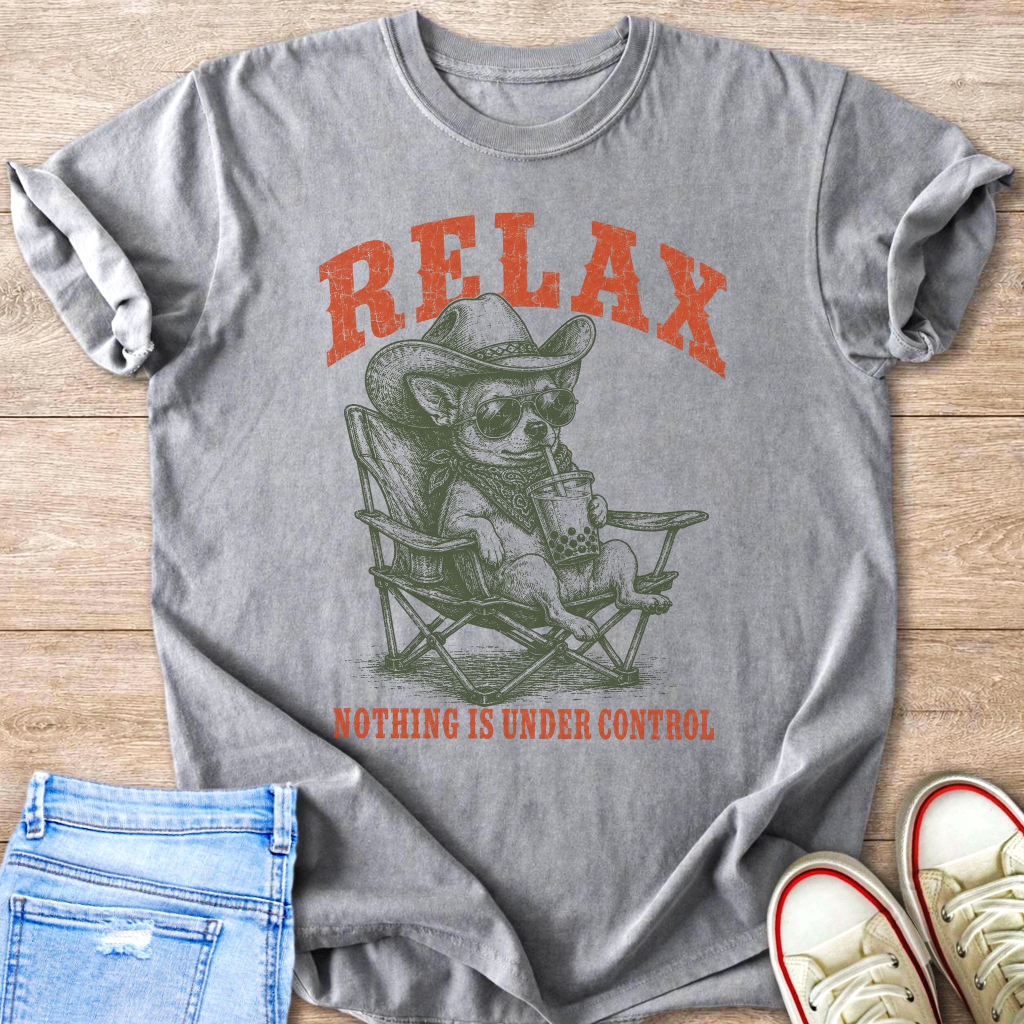 T-shirt with distressed print of dog in cowboy hat drinking bubble tea, "RELAX" and "NOTHING IS UNDER CONTROL" text.