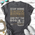 Distressed t-shirt with "Stay Home Drink Bourbon Smoke Cigar And Pet The Dog" text.
