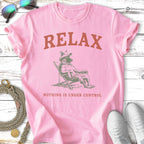 Pink t-shirt with "RELAX" and "NOTHING IS UNDER CONTROL" text and a relaxed dog graphic.
