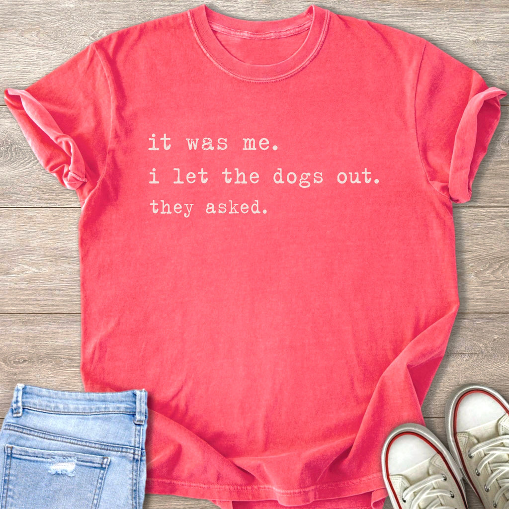 Coral t-shirt with white text: "it was me. i let the dogs out. they asked."