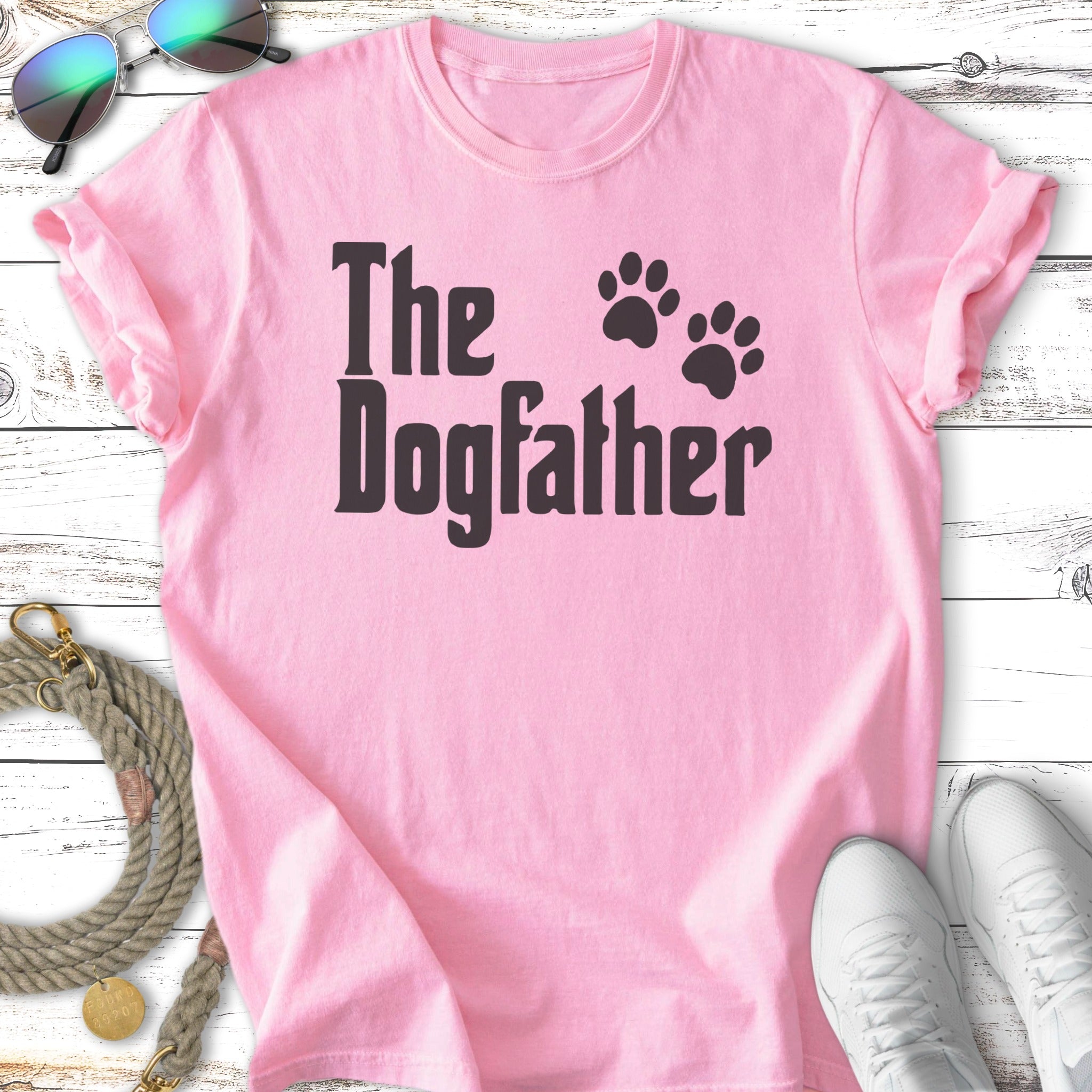 Pink t-shirt with "The Dogfather" and paw prints graphic.