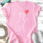 Pink t-shirt with a white outline of a French bulldog holding a red heart balloon.