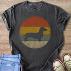 Dachshund silhouette on a vintage sunset background on a charcoal t-shirt.