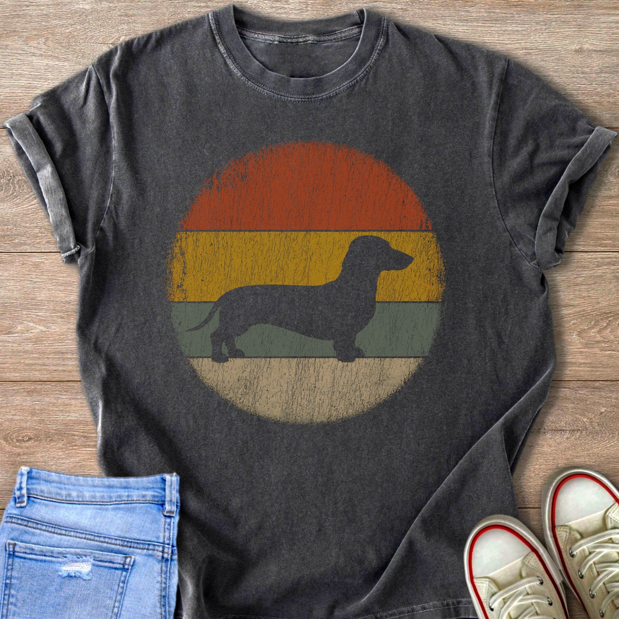 Dachshund silhouette on a vintage sunset background on a charcoal t-shirt.