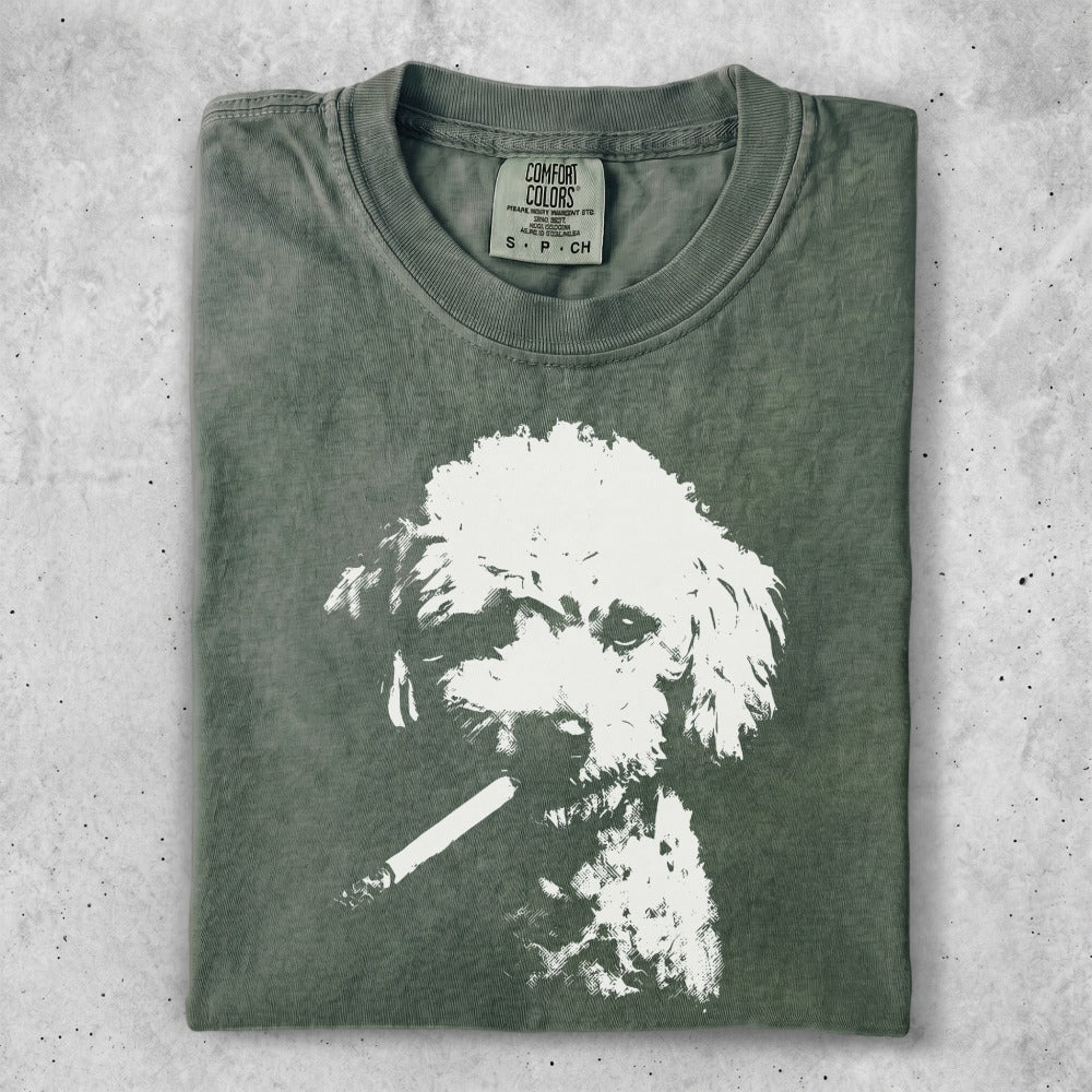 T-shirt with a faded print of a poodle smoking a cigarette.