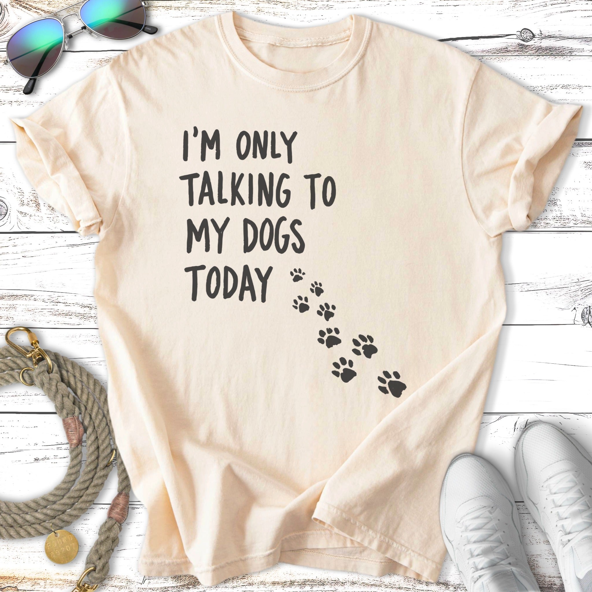 Cream t-shirt with "I'm only talking to my dogs today" and paw prints.