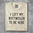 Cream t-shirt with "I LEFT MY ROTTWEILER TO BE HERE" text.