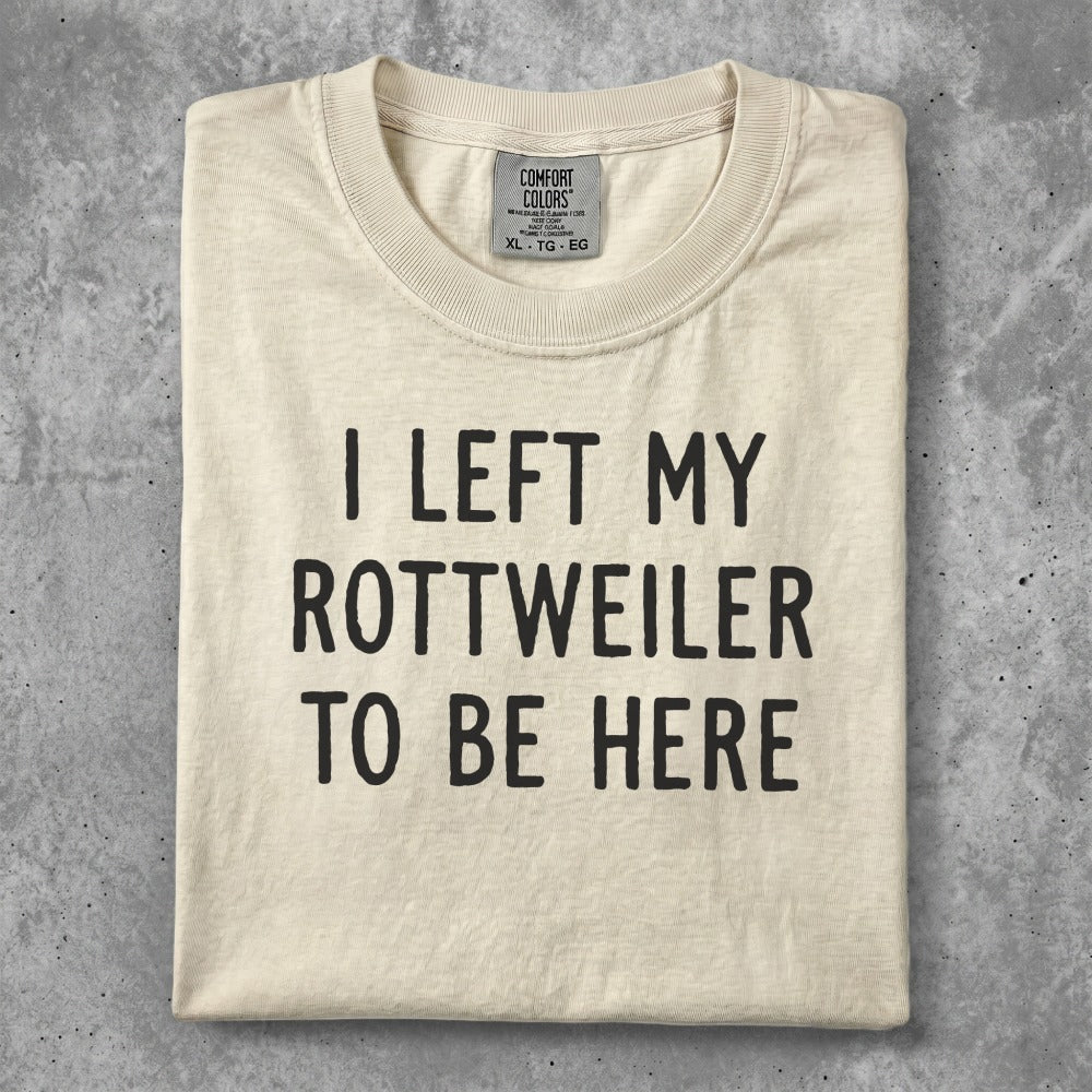 Cream t-shirt with "I LEFT MY ROTTWEILER TO BE HERE" text.