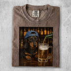 Dachshund wearing a blue cap pours beer into a large mug.