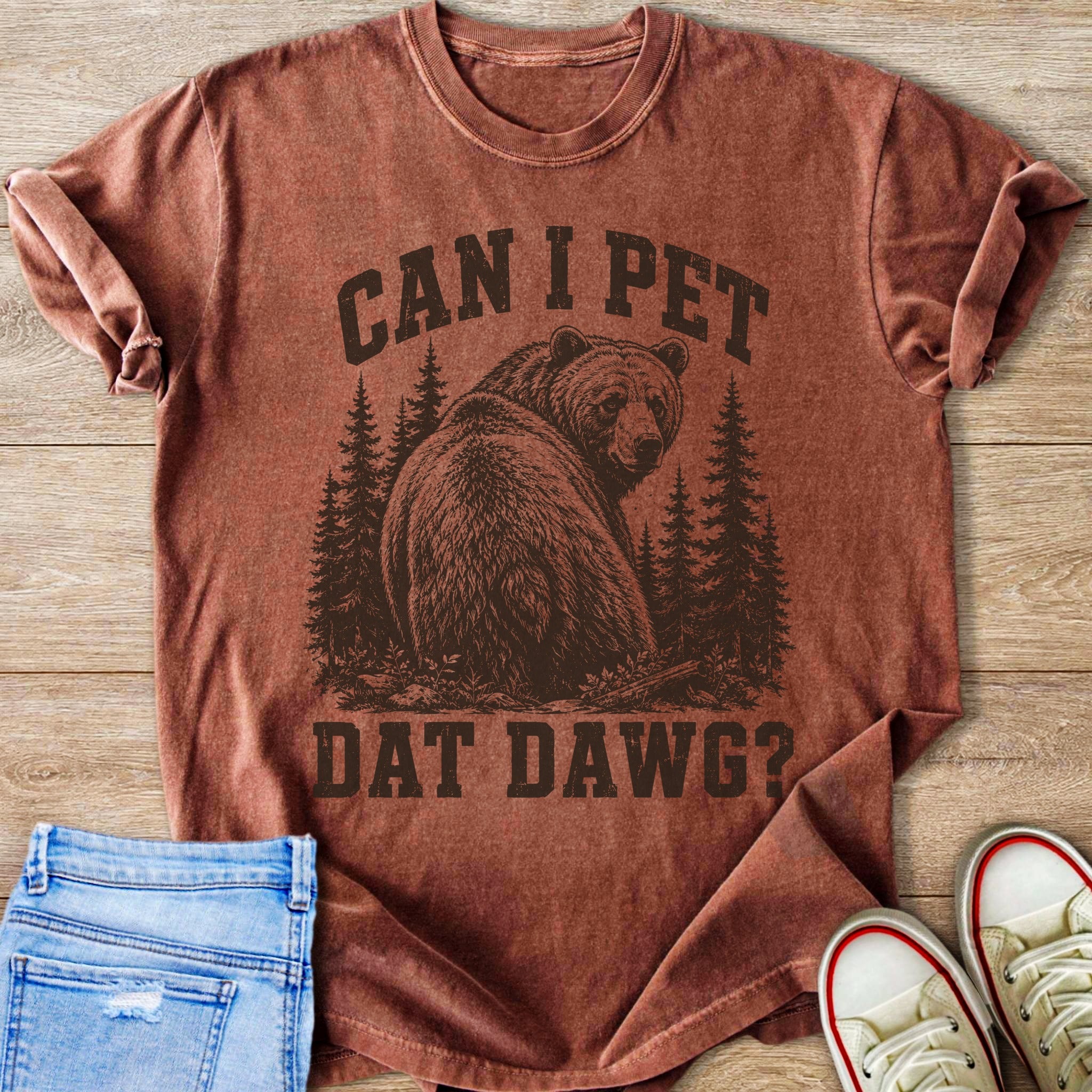 Brown t-shirt with distressed graphic of a bear and trees and the text "CAN I PET DAT DAWG?".