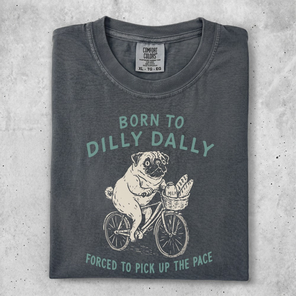 Dilly Dally t-shirt with a pug on a bicycle, text "Born to Dilly Dally".