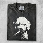 Washed black t-shirt with white poodle graphic smoking a cigarette.