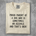 Cream t-shirt with "Proud parent of a dog who is sometimes an asshole and that's okay." text.