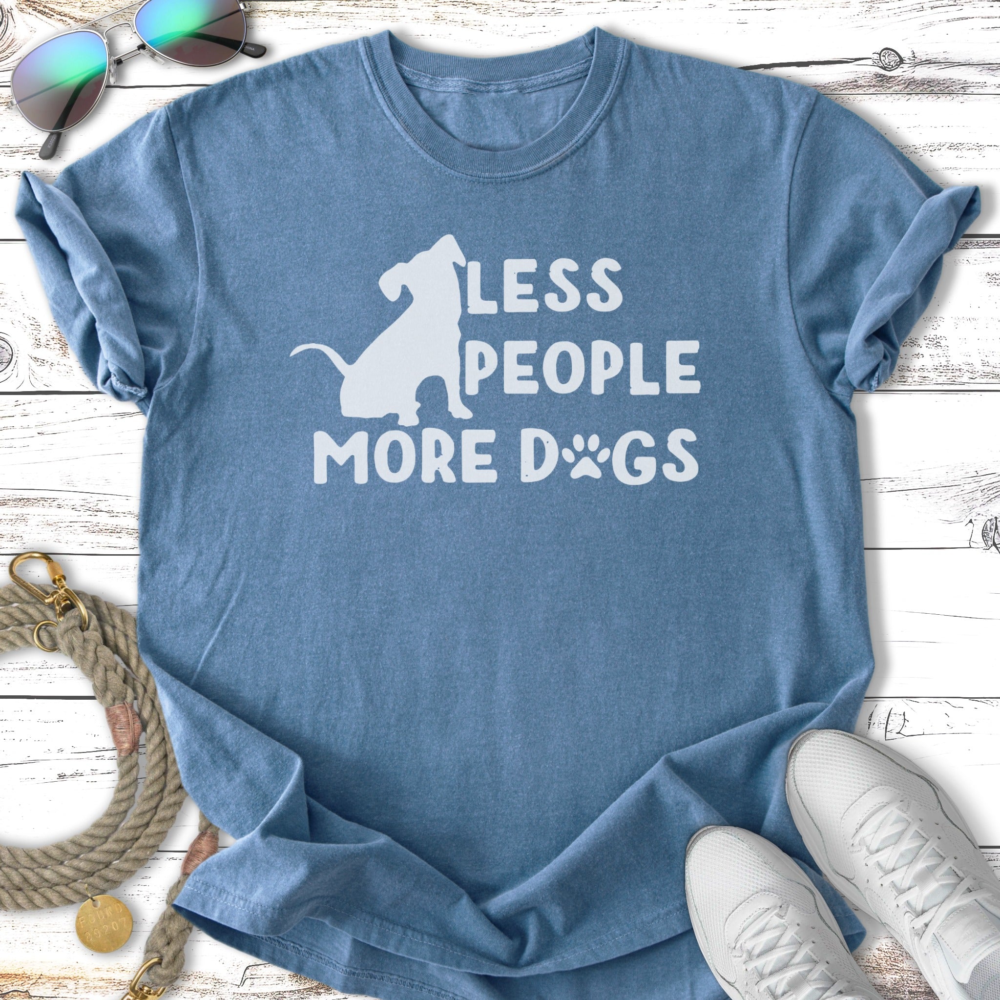 Blue t-shirt with "LESS PEOPLE MORE DOGS" text and a dog silhouette.