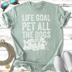 Green t-shirt with "Life Goal Pet All The Dogs" and dog silhouettes.