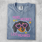 Dachshund wearing heart sunglasses with "MORE WEENIES LESS MEANIES" text.