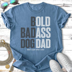 Blue t-shirt with "BOLD BADASS DOG DAD" text and sunglasses.