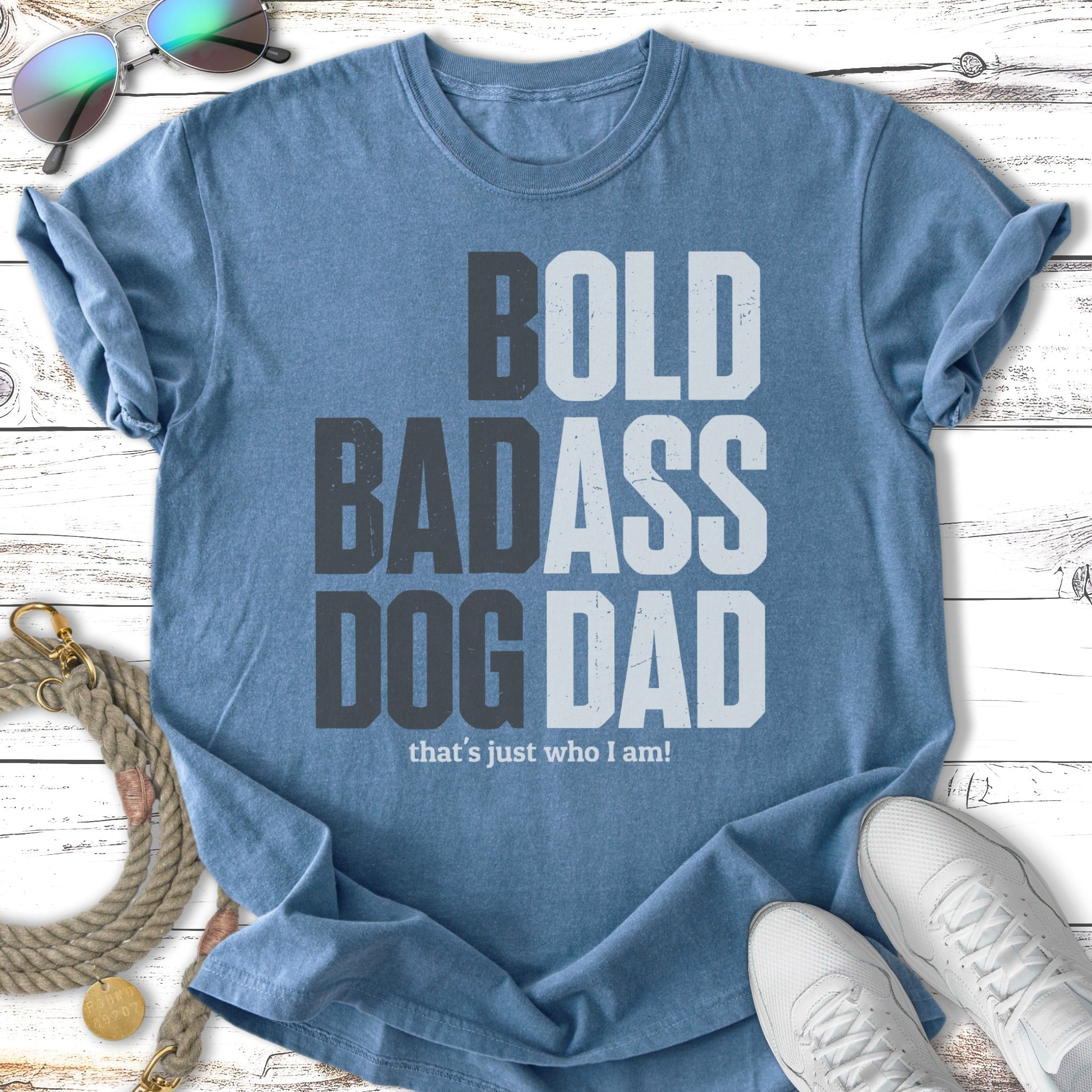 Blue t-shirt with "BOLD BADASS DOG DAD" text and sunglasses.