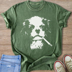 Green t-shirt with white graphic of a Cavalier King Charles Spaniel holding a cigarette.