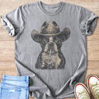 Boston Terrier in cowboy hat drinking from a straw cup, graphic tee.