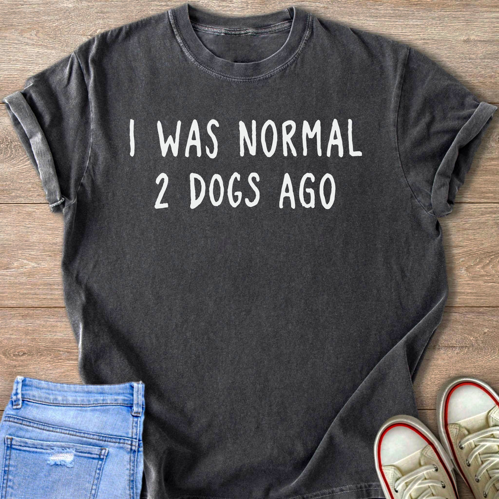 Dark gray t-shirt with white text that reads "I WAS NORMAL 2 DOGS AGO".