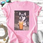 Husky in sunglasses sips iced coffee from a plastic cup.