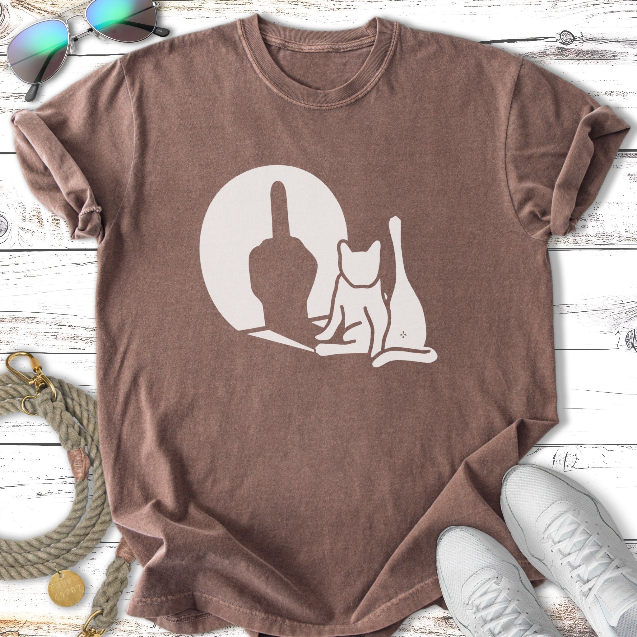 Brown t-shirt with white graphic of a cat and middle finger silhouette.