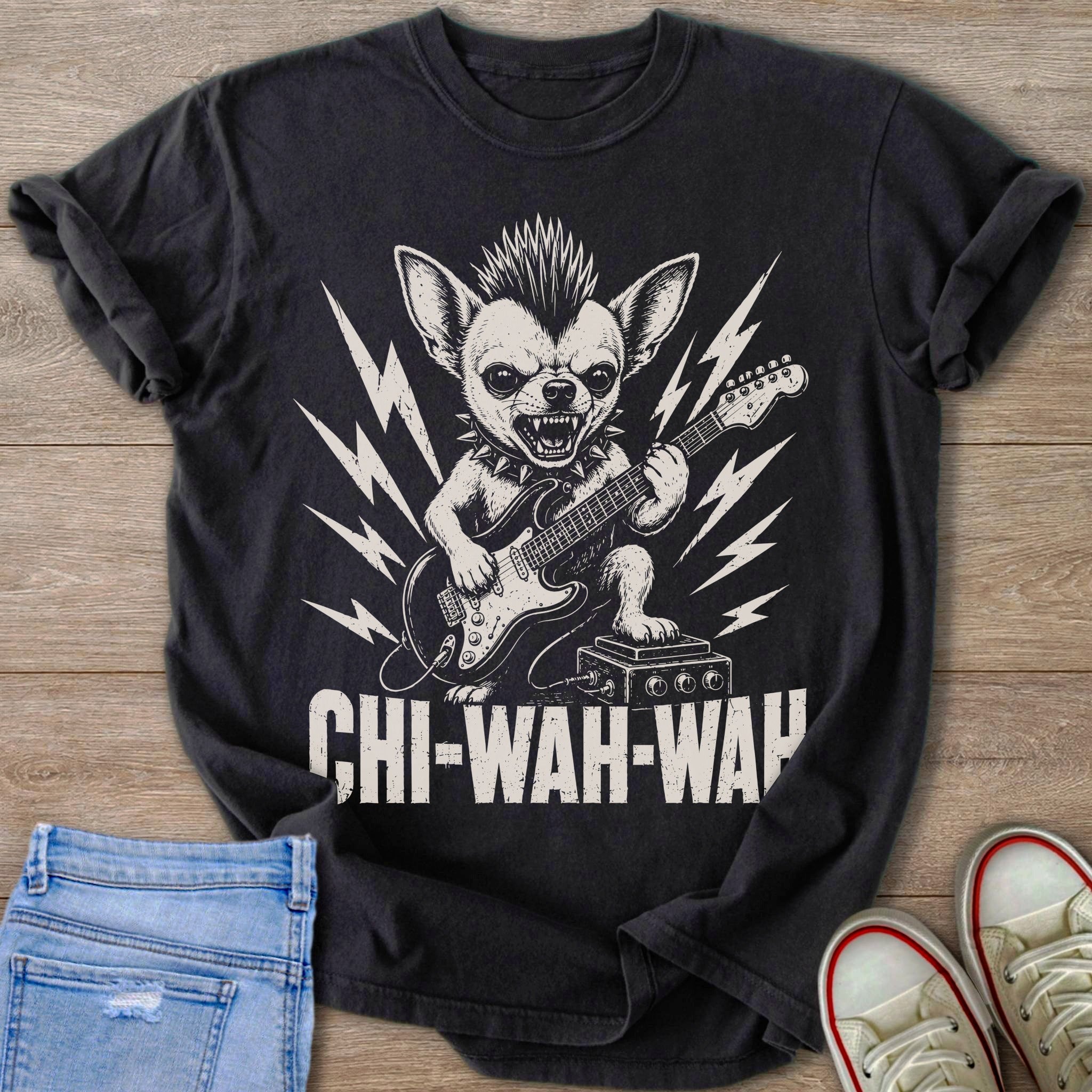 Chihuahua with mohawk playing electric guitar on dark t-shirt with "CHI-WAH-WAH" text.