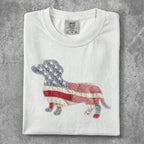 White t-shirt with a dachshund silhouette made of American flag patchwork.