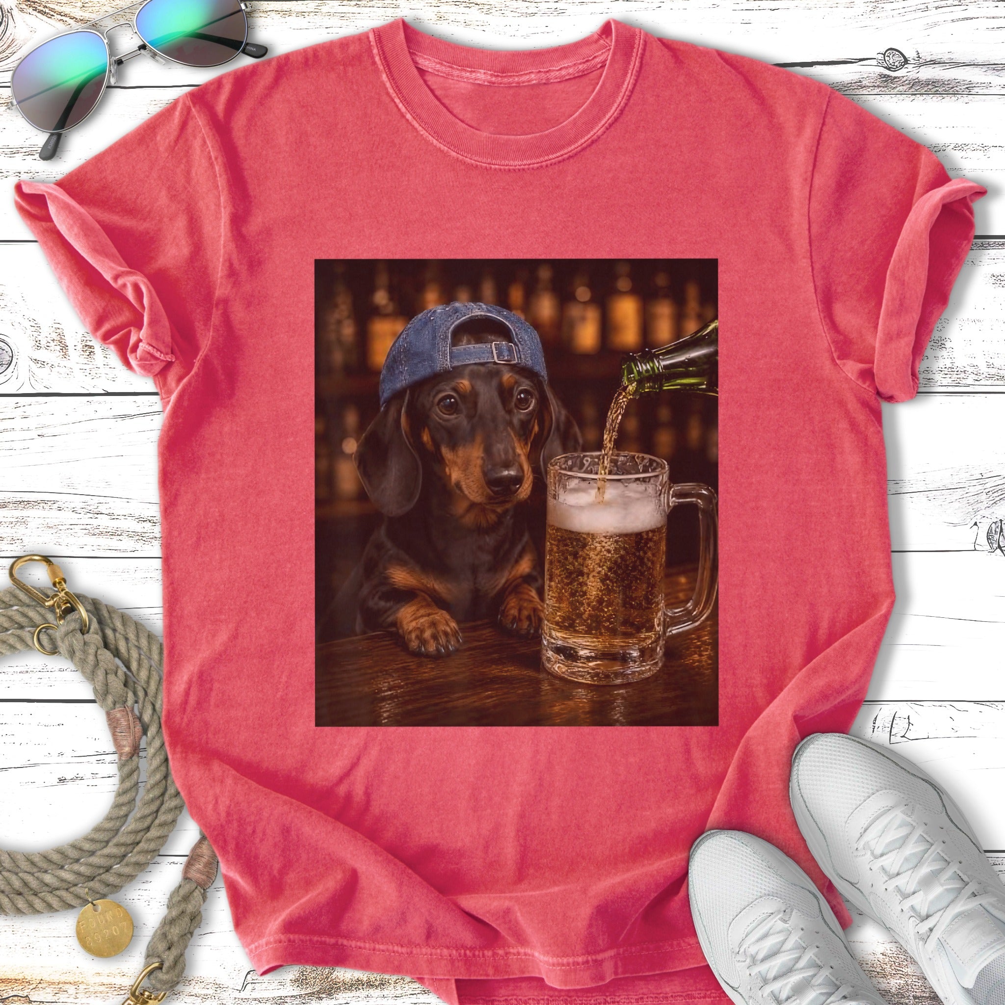 Dachshund wearing a baseball cap pours beer into a mug.