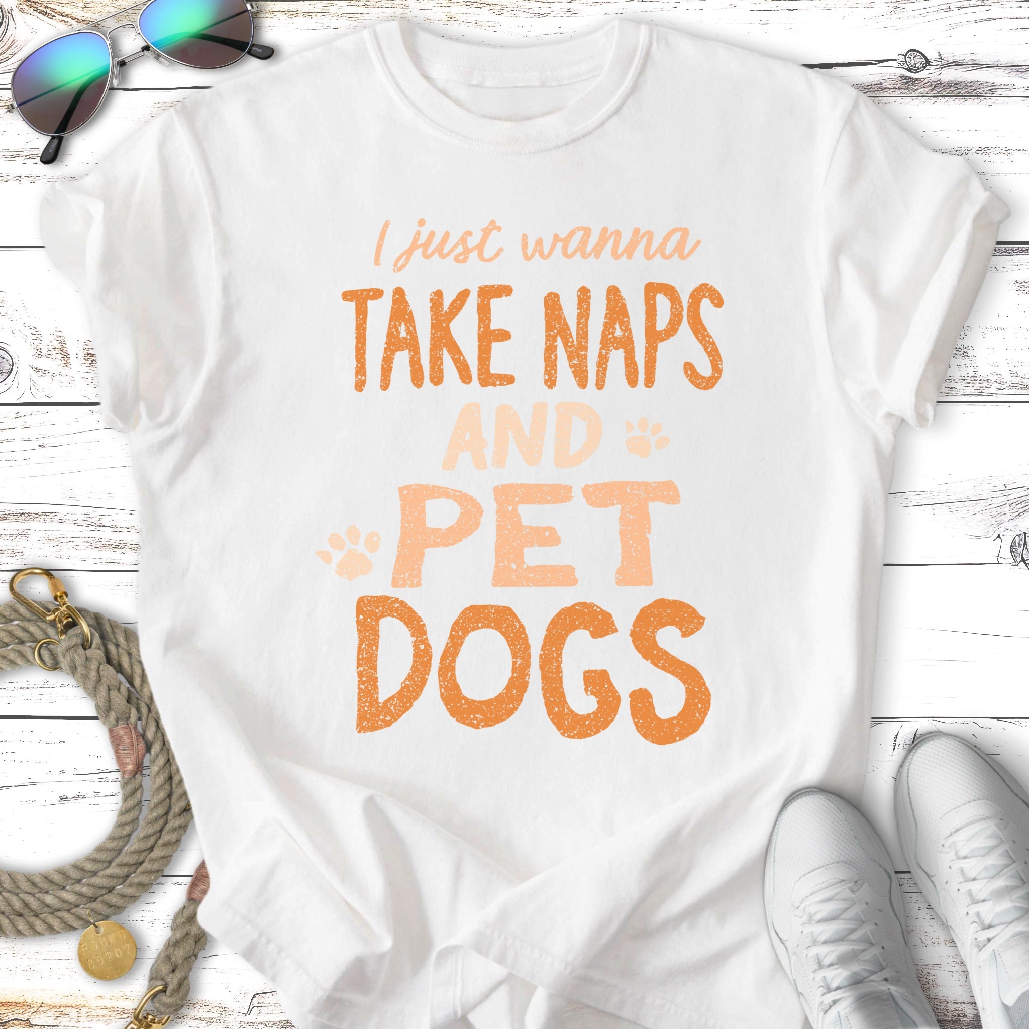 White t-shirt with orange text "I just wanna take naps and pet dogs".