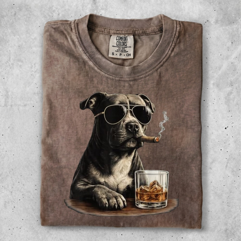 Pit bull dog wearing sunglasses, smoking a cigar, with whiskey.