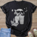 Shih Tzu dog wearing sunglasses and drinking a beverage from a clear cup.