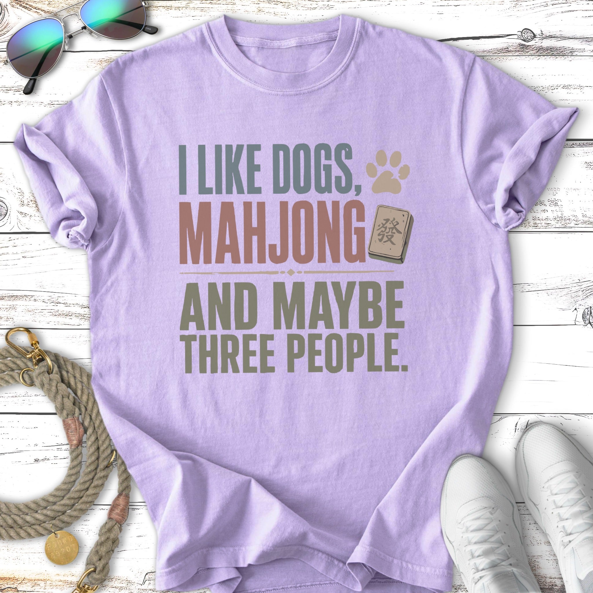 Purple t-shirt with text "I like dogs, mahjong and maybe three people."