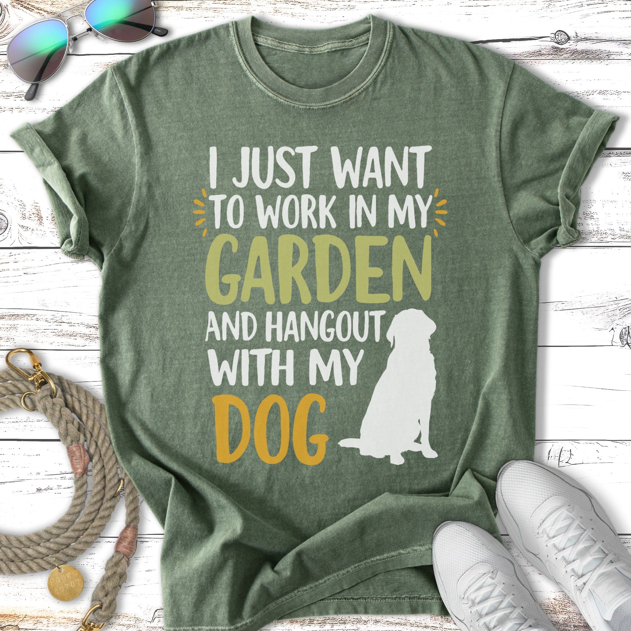 Green t-shirt with text "I just want to work in my garden and hangout with my dog" and a dog silhouette.