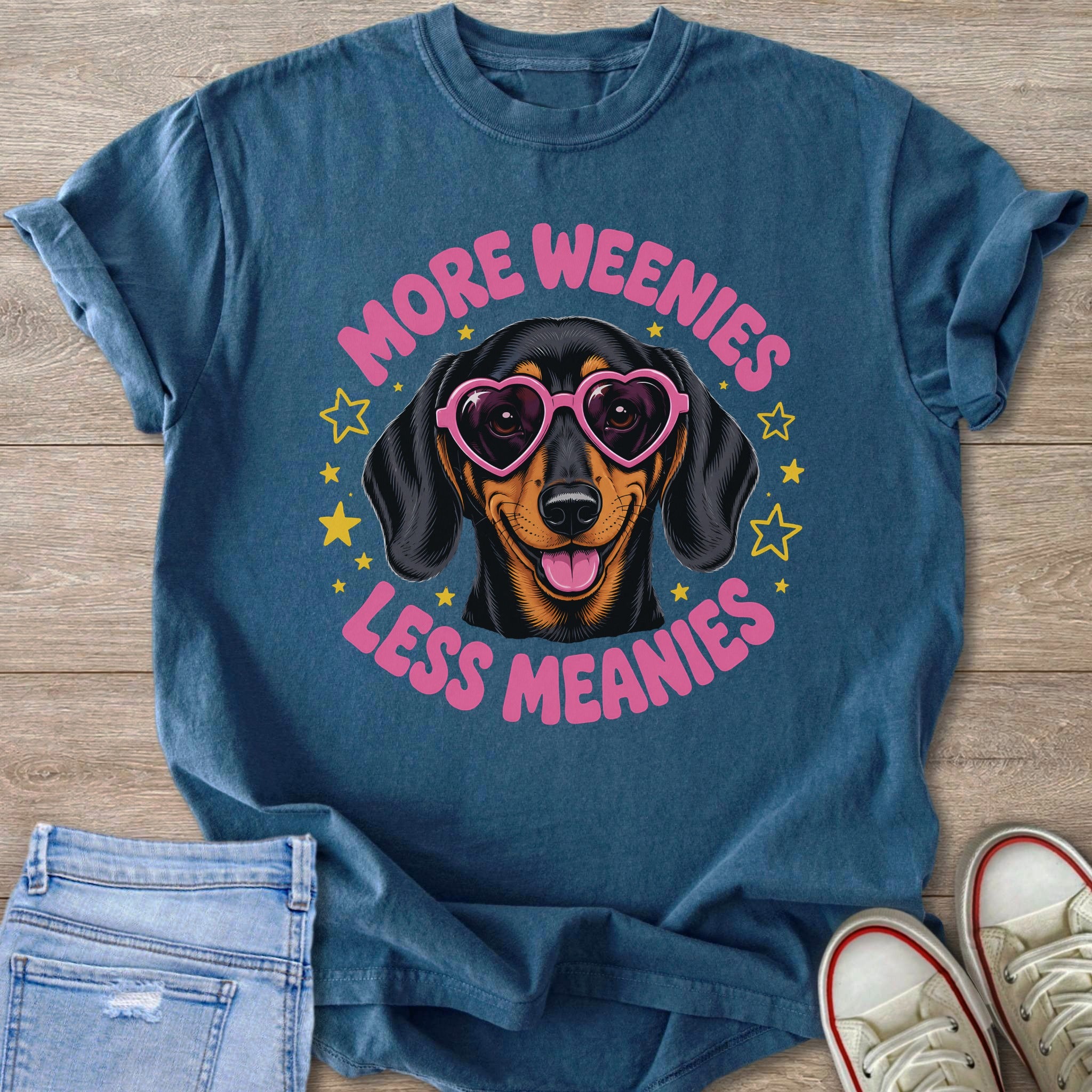 T-shirt with a dachshund wearing heart sunglasses and text "More Wienies Less Meanies".