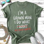 Green t-shirt with "I'm a grown man I do what I want my dog wants" text.