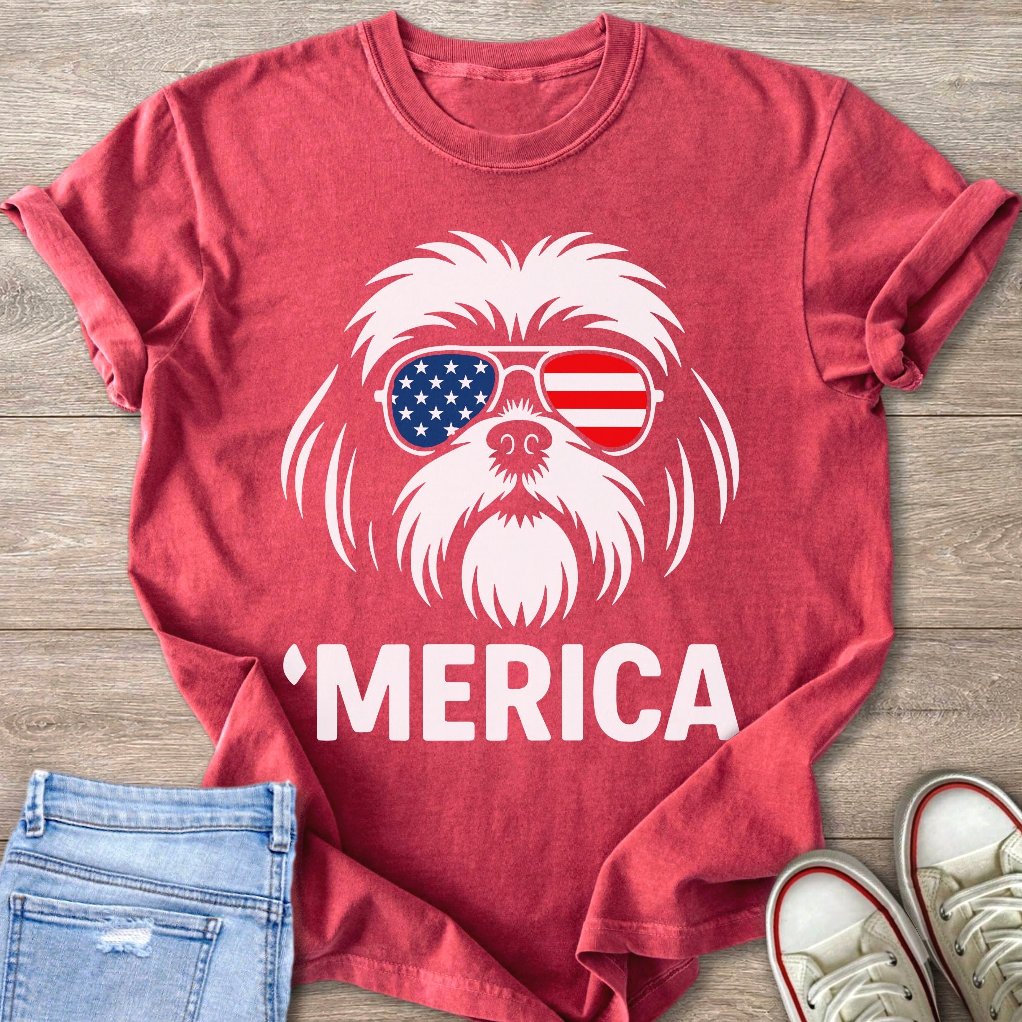 Red t-shirt with white graphic of dog wearing American flag sunglasses and text 'MERICA.