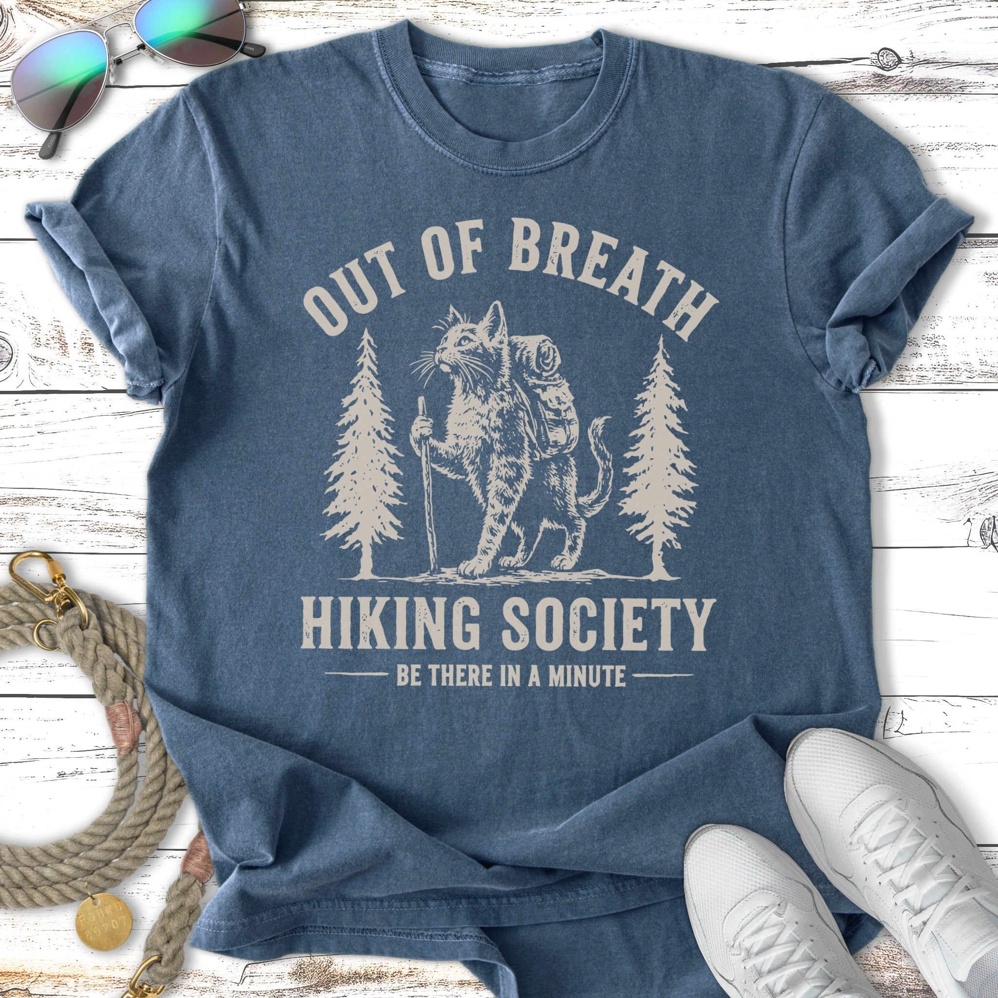 T-shirt with cat hiking design and text "Out of Breath Hiking Society".