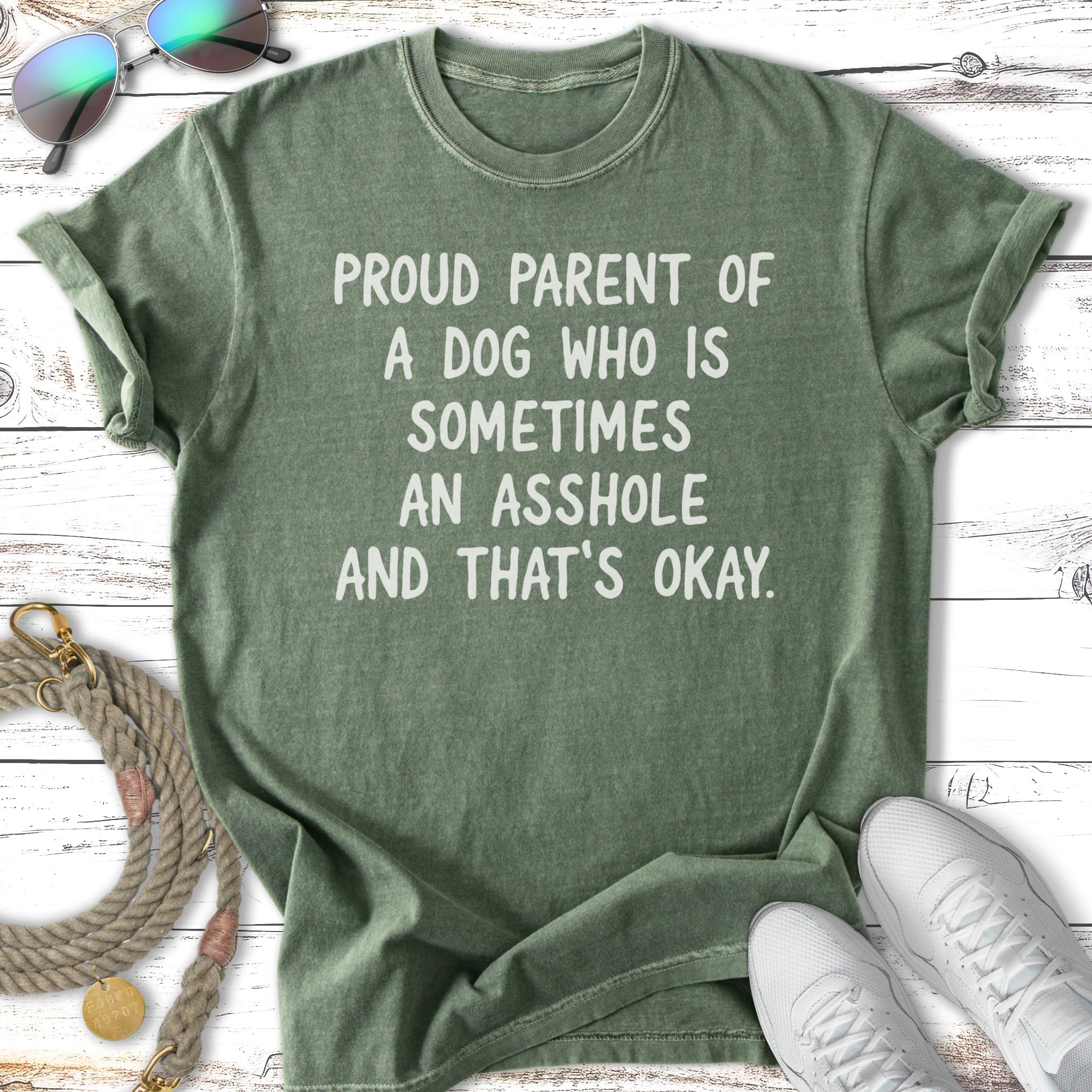 Green t-shirt with "Proud parent of a dog who is sometimes an asshole and that's okay" text.