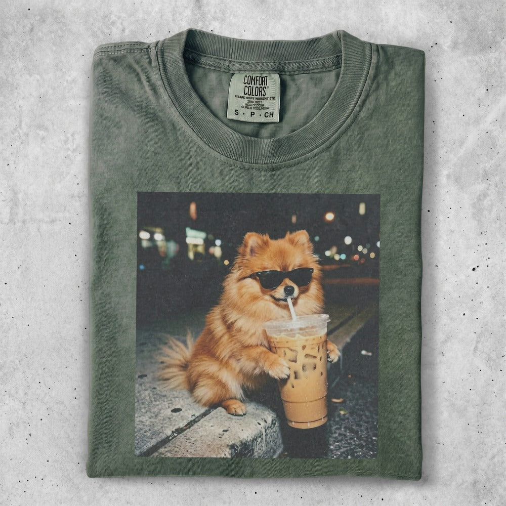 Green t-shirt featuring a Pomeranian dog wearing sunglasses with a coffee drink.