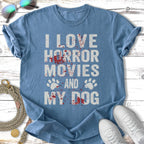 Blue t-shirt with "I LOVE HORROR MOVIES AND MY DOG" and paw prints.