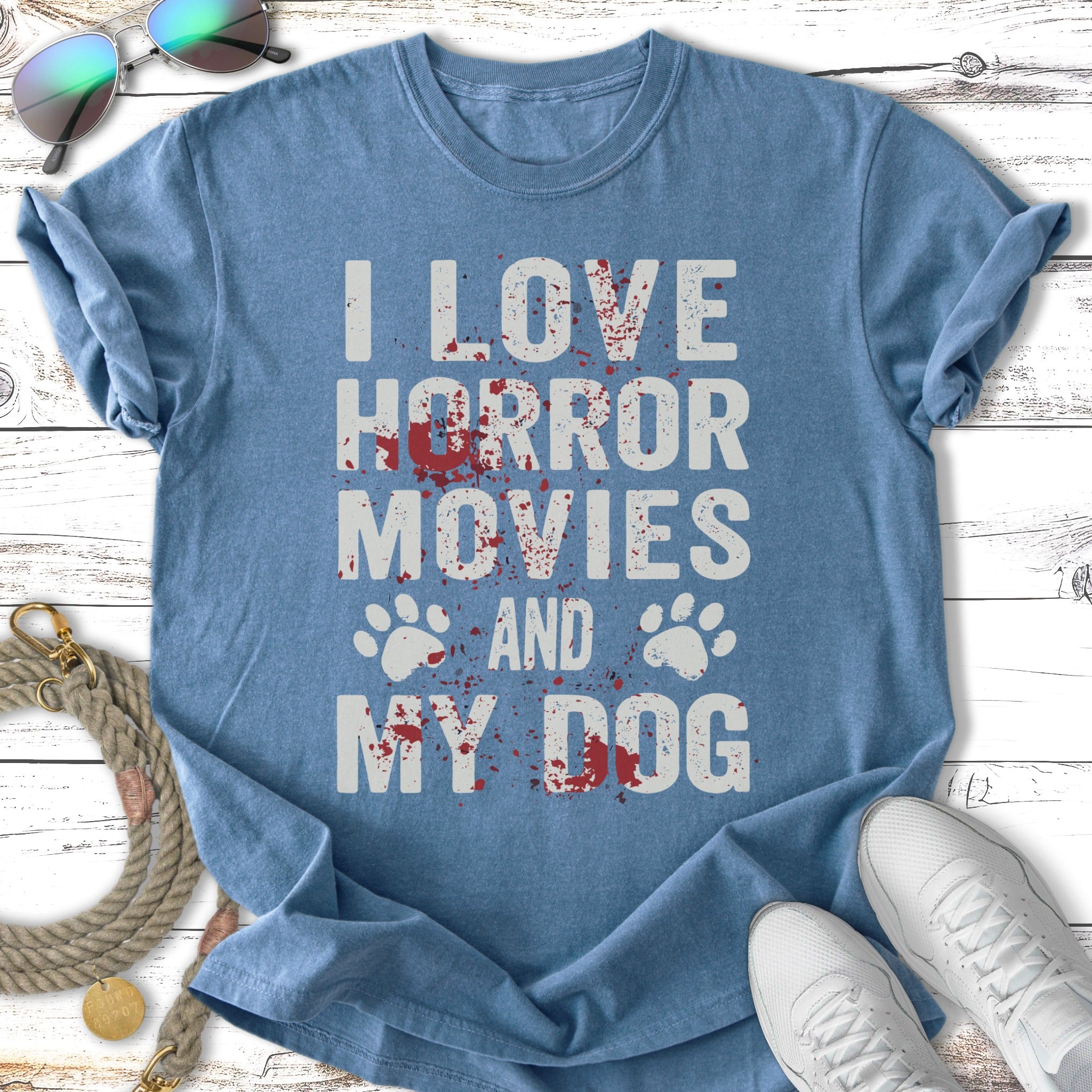 Blue t-shirt with "I LOVE HORROR MOVIES AND MY DOG" and paw prints.
