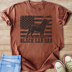 Black Labrador silhouette on distressed American flag with "BLACK LAB DAD" text.