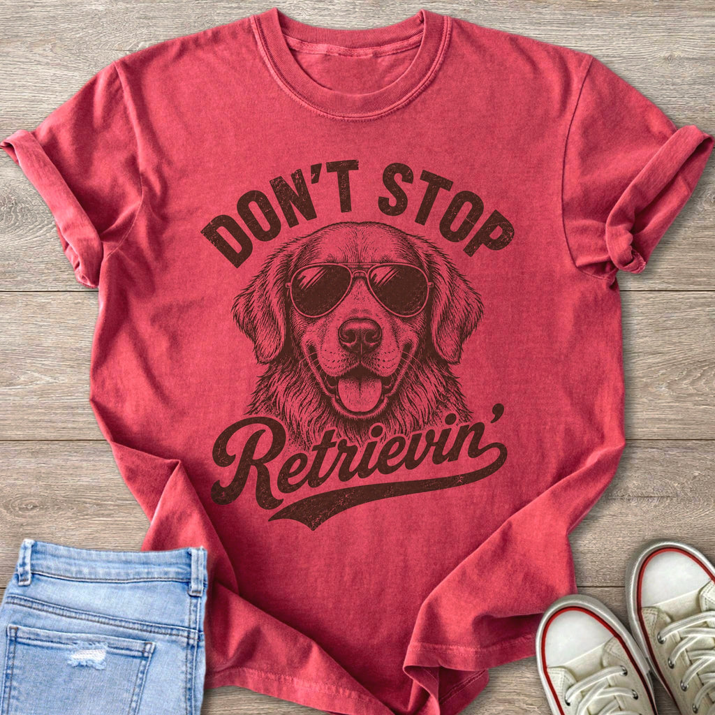 Red t-shirt with a golden retriever wearing sunglasses and text "Don't Stop Retrieving".