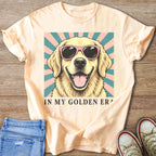 Golden retriever wearing pink sunglasses, text "IN MY GOLDEN ERA".