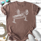Cat lifting weights on a bench press with barbells.
