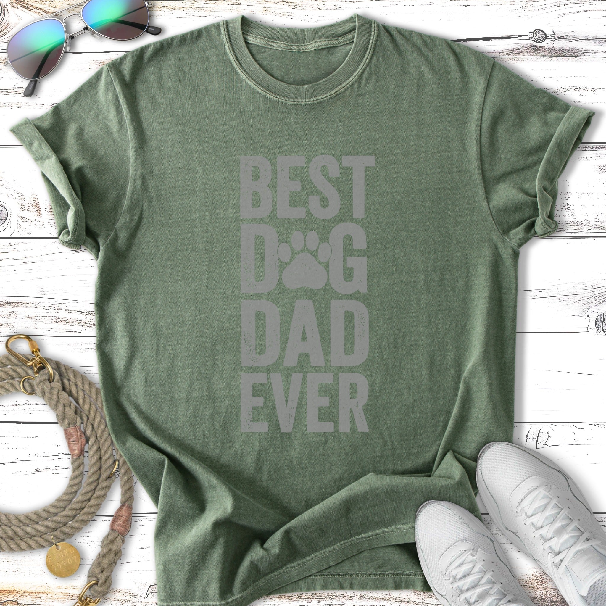 Green t-shirt with "BEST DOG DAD EVER" text and paw print graphic.